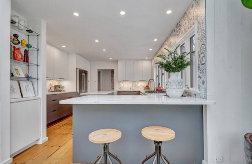 Old Lyme House | Luxurious midcentury modern glass house in the woods, chefs kitchen & great art